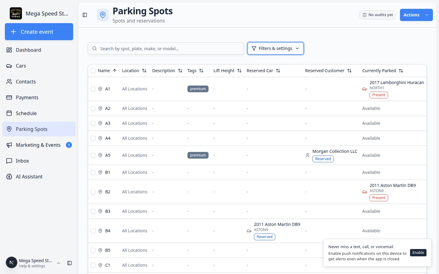 Parking Spots table view listing spot names, reserved customers, currently parked vehicles, and status